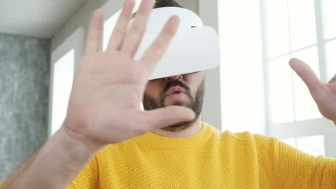 Future is now. Handsome man playing game in vr glasses. Stock Footage 85738535