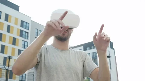 Future is now. Handsome man playing game in vr glasses. Stock Footage 94061431