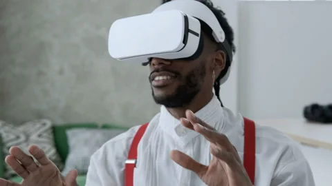 Future is now. Handsome man playing game in vr glasses. Stock Footage 99656841