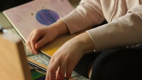 The future of the planet. Children's hands draw with color pencils drawings in a Stock Footage 127991868