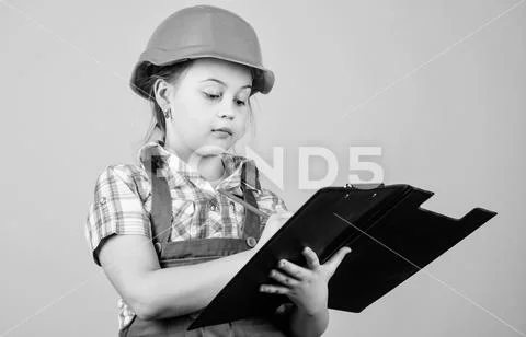 Future profession. Kid builder girl. Build your future yourself. Initiative Stock Photos