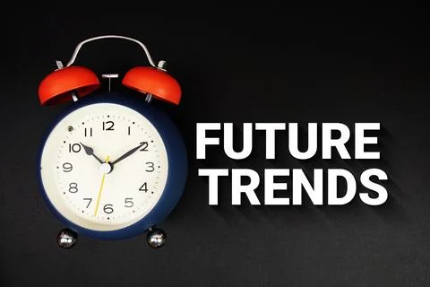 Future Trends text with alarm clock on black background Stock Photos