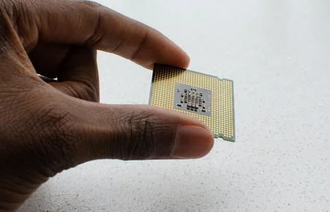 The future in your hands: close-up of a computer processor, embodying the c.. Stock Photos