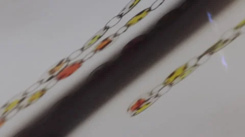 Futuristic Abstractions: Moving Chains in a Dreamlike Glow Stock Footage 304368126