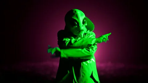 Futuristic alien dancing on dark backdrop. Funny meme footage of humanoid on Stock Footage 199670471