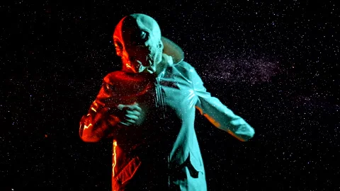 Futuristic alien dancing on stars space, sky backdrop. Funny meme footage of Stock-Footage 200410357