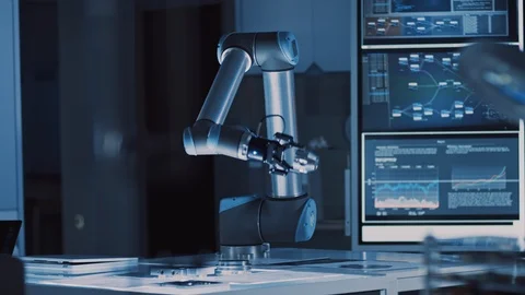 Futuristic Artificial Intelligence Robotic Arm Operates and Moves a Metal Object Stock Footage
