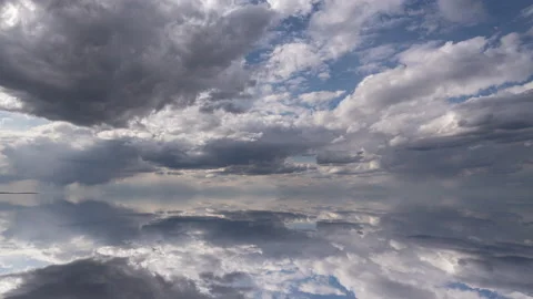 Futuristic background consisting of Time lapse clip of white fluffy clouds over Stock Footage 197457462
