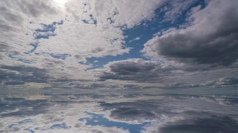 Futuristic background consisting of Time lapse clip of white fluffy clouds over Stock Footage 248914919