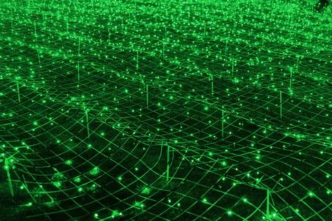 Futuristic background of green led lights arranged in grid pattern, network.. Illustrazione stock