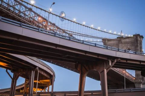 Futuristic bifurcation under the Brooklyn bridge in late sunset Stock Photos