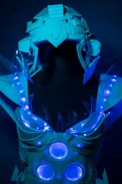 Futuristic, bionic armor with blue LED lights and plastic materials Stock Photos