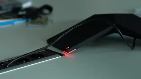 Futuristic black phone with red light to make video call to colleagues in Video stock 119364571