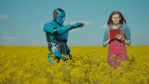 Futuristic blue cyborg repeating commands of young woman farmer cooperating at Stock Footage 133293208