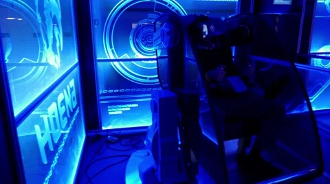 Futuristic blue room with 5D simulator shaking a man in virtual reality oculus Video stock 67251614