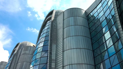 Futuristic building on time lapse background with clouds on blue sky, zoom in. Stock Footage 232761215