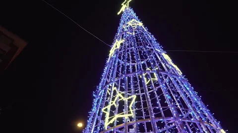 Futuristic christmas tree with blue led lights and yellow stars Stock Footage 340827504