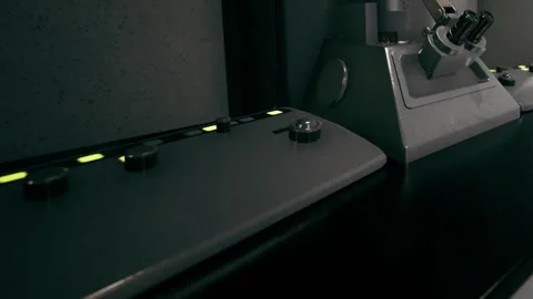 Futuristic Control Panel Illuminated in a Dimly Lit, High Tech Room Stock Footage 348490662