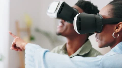 Futuristic couple with VR or virtual reality glasses excited with interface in Stock Footage 225455272