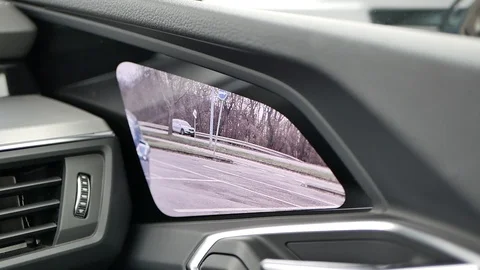 Futuristic cutting edge tech virtual side view mirror camera monitor on car Stock Footage 122496372