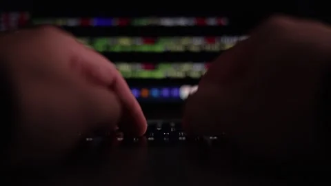 Futuristic Cybersecurity Coding Workspace with Neon Blue and Purple Lights Stock Footage 336582188