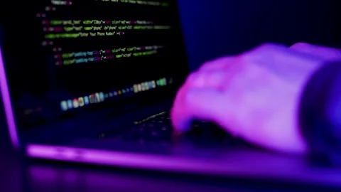 Futuristic Cybersecurity Coding Workspace with Neon Blue and Purple Lights Stock Footage 337991500