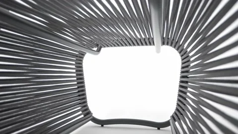 Futuristic design of a gray rope pouf for seating on a metal frame. Stock Footage 220073526