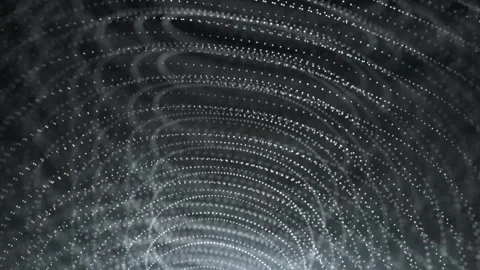 A futuristic digital background with rotating glowing particles forming curve Stock Footage 314464771