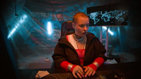 Futuristic Female Hacker Typing on Computer Keyboard in Neon Office Stock Footage 327634610