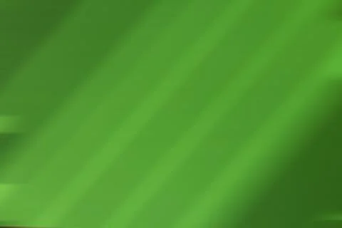 Futuristic green background with diagonal lines in blur Stock Photos
