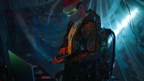 Futuristic Hacker Stealing Data Using Computer in Neon Underground Room Stock Footage 327635472