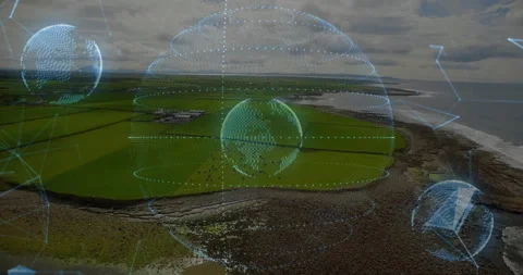 Futuristic holographic sphere floating above coastal farmland, mapping data with Stock Footage 307431575