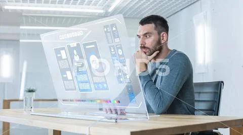 In the Futuristic Laboratory Creative Engineer Works on the Transparent Computer Stock Photos