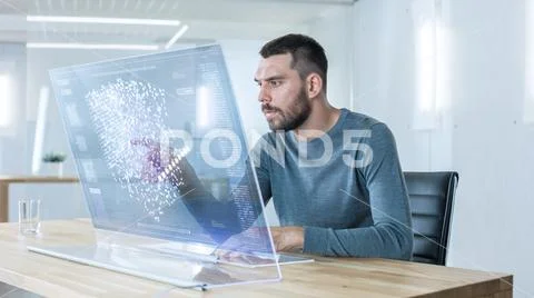 In the Futuristic Laboratory Creative Engineer Works on the Transparent Computer Stock Photos