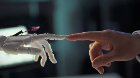 Futuristic link between human and robotic hand showcases tech advancement Stock Footage 323805619