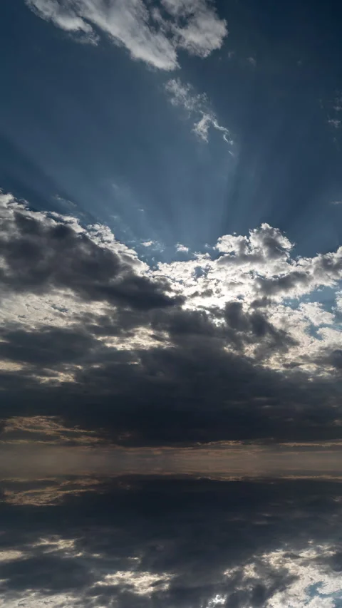 Futuristic mirrored cloudscape forming a vertical portal effect. Dramatic Stock Footage 335714803