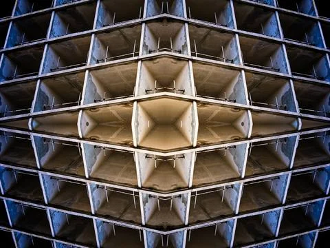 Futuristic mirrored pattern made from architectural elements in rich colours  Stock Illustration