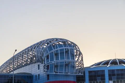 Futuristic modern building architecture featuring curved steel frame struct.. Stock Photos