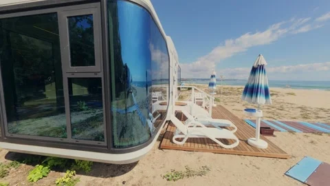 Futuristic Modern Capsule House on Sandy Beach Near the Sea Horizon Stock Footage 346691165
