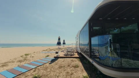 Futuristic Modern Capsule House on Sandy Beach Near the Sea Horizon Stock Footage 346691425