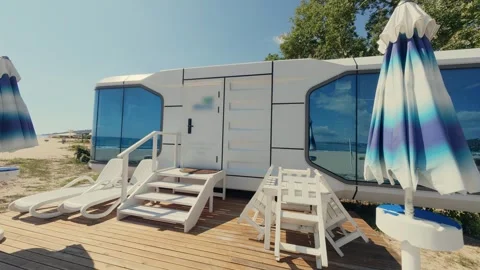 Futuristic Modern Capsule House on Sandy Beach Near the Sea Horizon Stock Footage 346691529