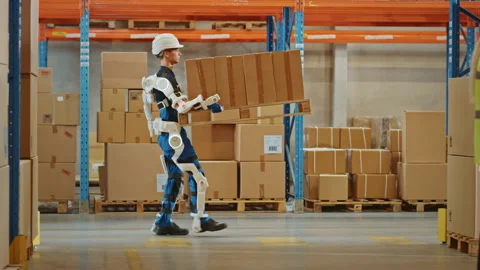 Futuristic Modern Warehouse Worker with Exoskeleton Suit Moves Stock Footage 141576749