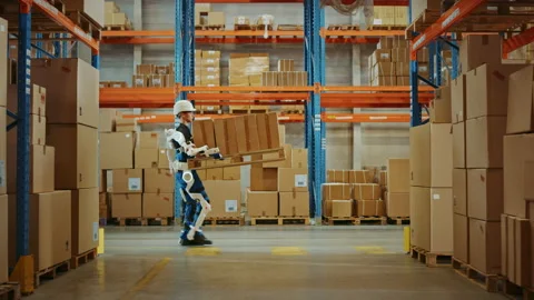 Futuristic Modern Warehouse Worker with Exoskeleton Suit Moves Stock Footage 141576851