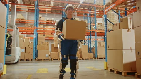 Futuristic Modern Warehouse Worker with Exoskeleton Suit Moves Stock Footage 141577370