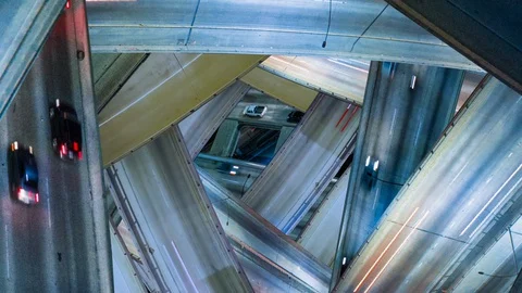 Futuristic multi level freeway interchange Stock Footage 128129911