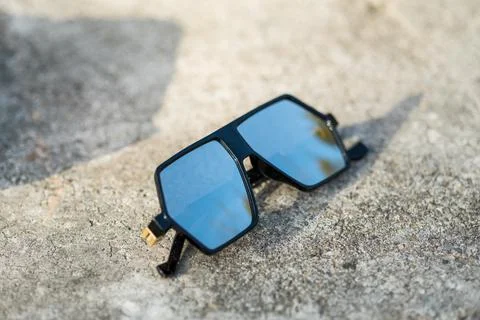 Futuristic oversized sunglasses model with silver color lenses shoot outdoor Stock Photos