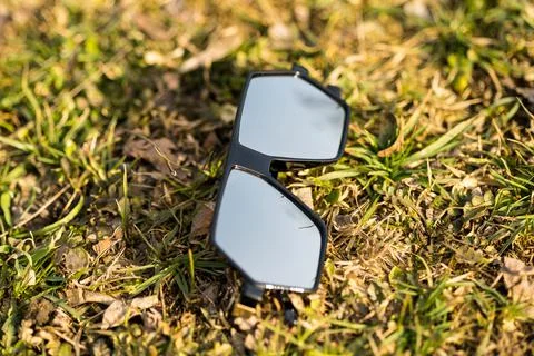 Futuristic oversized sunglasses model with silver color lenses shoot outdoor on Stock Photos