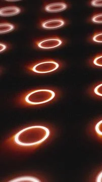 Futuristic pattern of glowing orange rings on dark surface with depth and s.. 库存插图