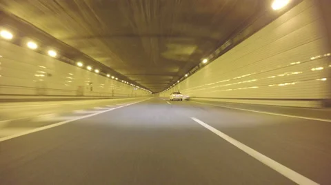 Futuristic POV drive through the empty tunnels on the Bayshore Highway. Stock Footage 61886746