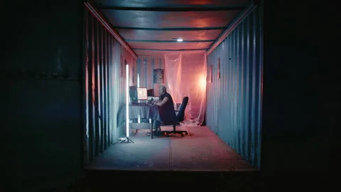 Futuristic Programmer With Mohawk Using Multiple Computer Displays Stock Footage 341656891